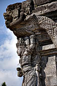 Candi Panataran - Naga Temple. Priestly figure and corner naga. 